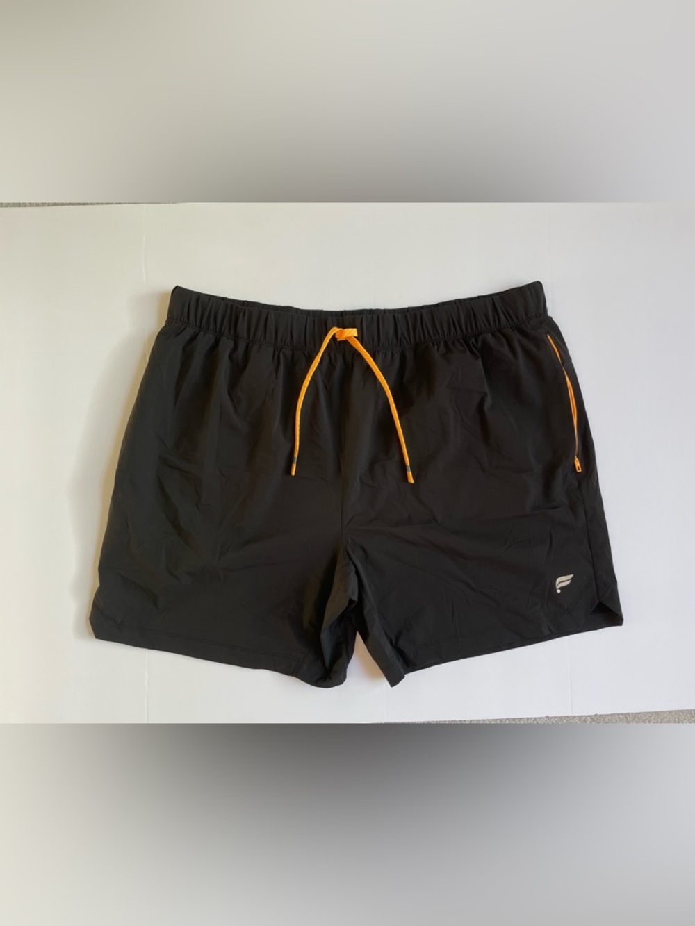 Men’s Fabletics Black “The One Short 5in” shorts with Orange Drawstring Accent